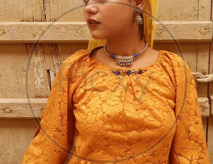 a girl in traditional Rajasthani attire.