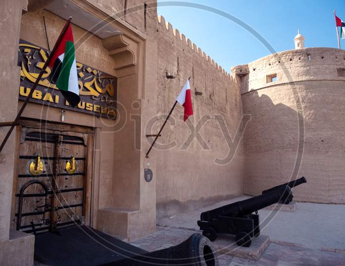 Feb 27Th, 2021, Bur Dubai, Uae. View Of The Old Vintage Door,Canons And Signboard At The Entrance To The Museum Of Dubai Uae Captured At Bur Dubai, Uae.