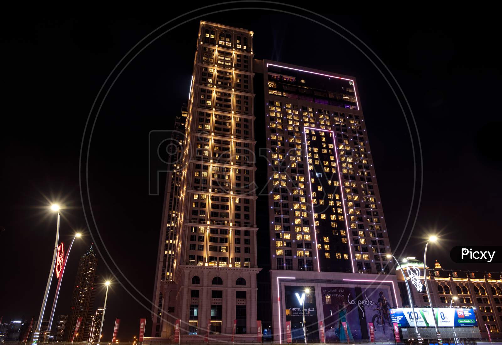 Jan 1St ,2021, Dubai Uae. The V Hotel Captured At Night On The Busy Sheikh Zayed Road, Dubai, Uae. Long Exposure Photography. La Perle Event Hotel
