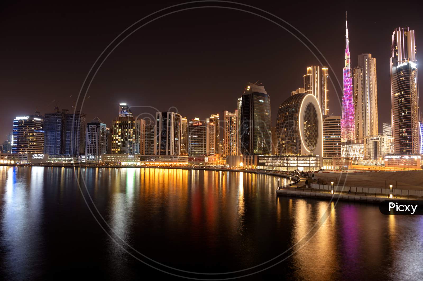 March 5Th,2021, Dubai,Uae. Beautiful View Of The Illuminated Sky Scrapers Along With Burj Khalifa Captured From The Marasi Drive At The Business Bay District, Dubai, Uae.