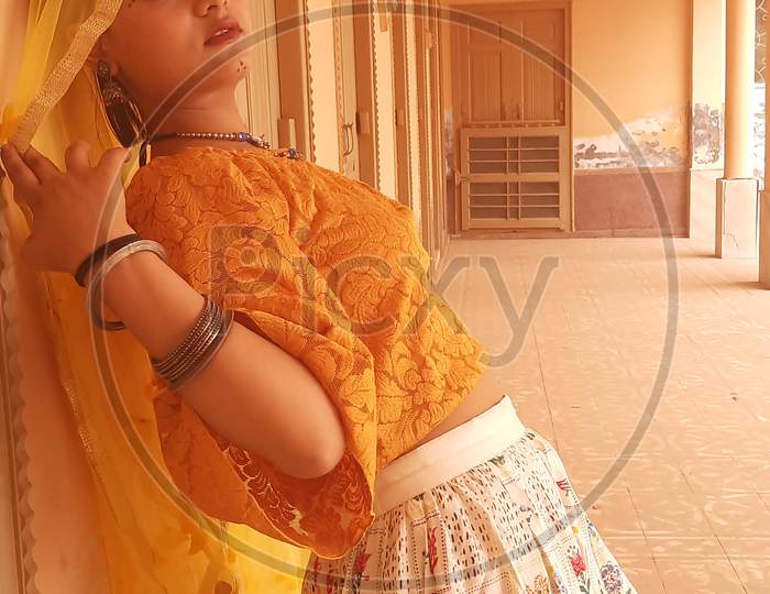 a girl in traditional Rajasthani attire.