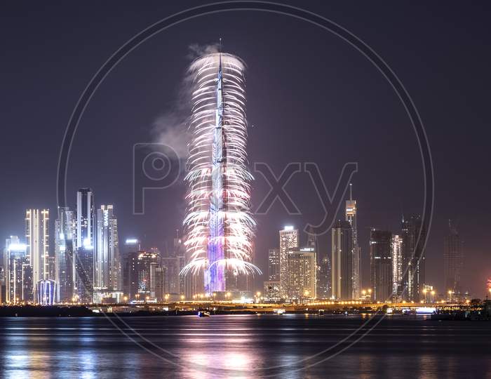 Jan 1St,2021, Dubai,Uae. View Of The Spectacular Fireworks At The Burj Khalifa Illuminated With The Uae Flag Colors During The New Year 2021 Celebration Captured From The Creek Harbor , Dubai , Uae.