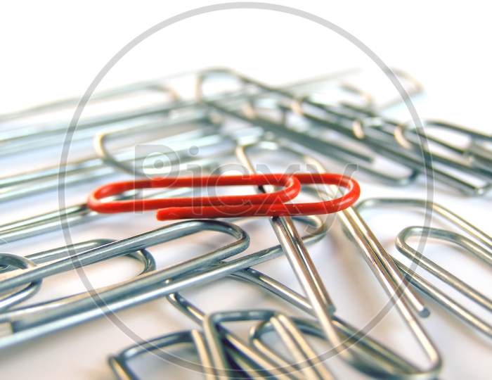 Red Clip Among Silver Clips