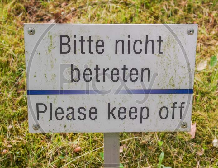 Please Keep Off From The Grass Sign
