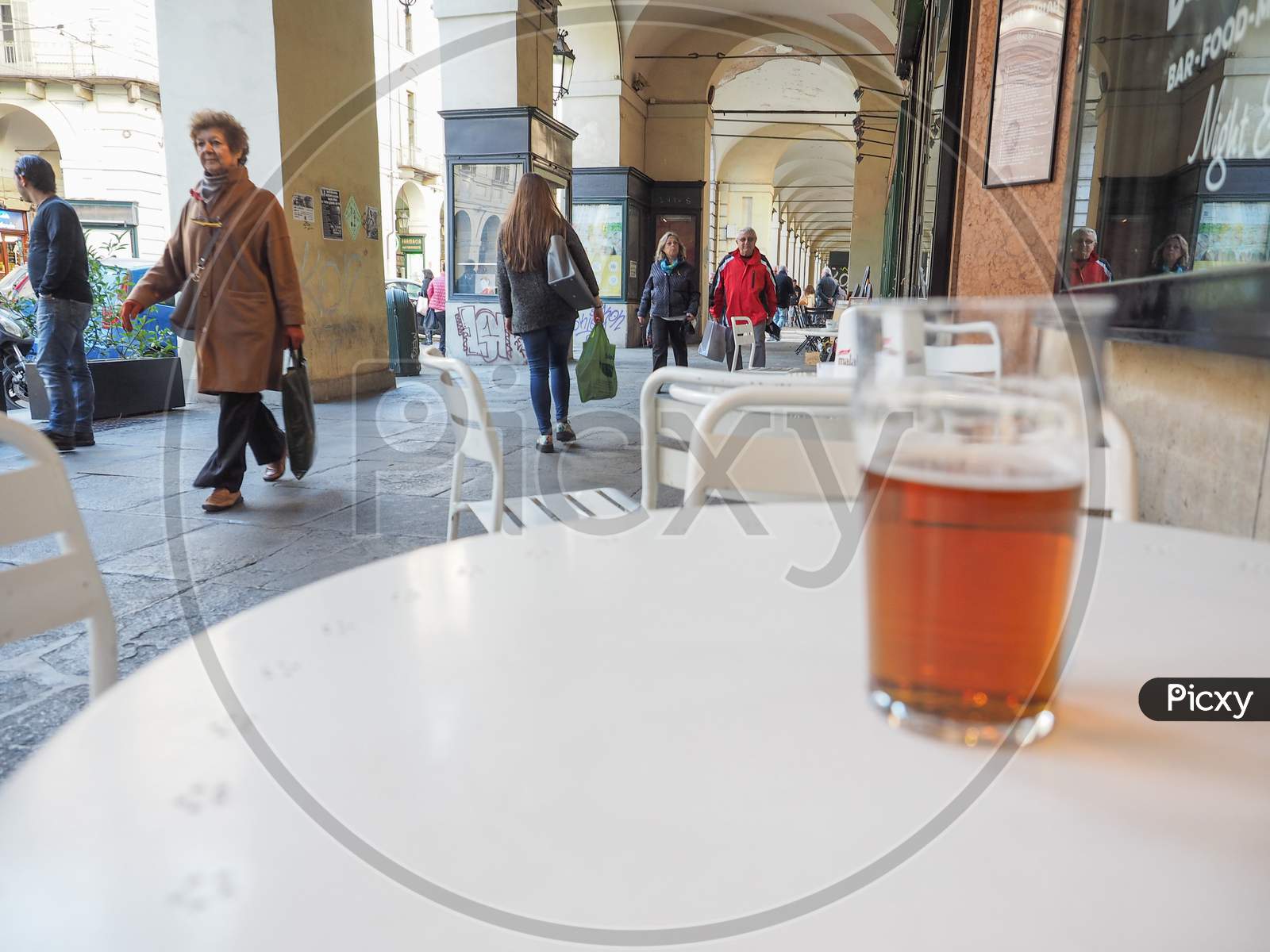 Turin, Italy - October 22, 2014: Pint Of British Ale On A Pub Table - Selective Focus On People