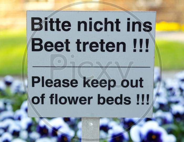 Keep Out Of Flower Beds Sign