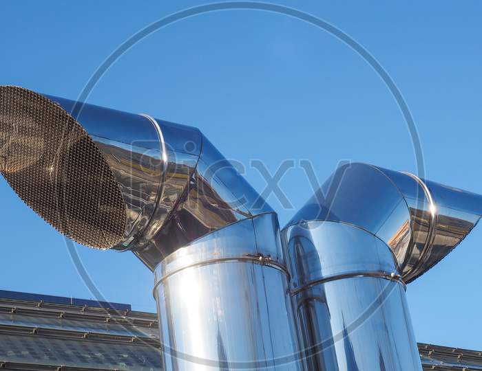 Vent Pipes Over Blue Sky