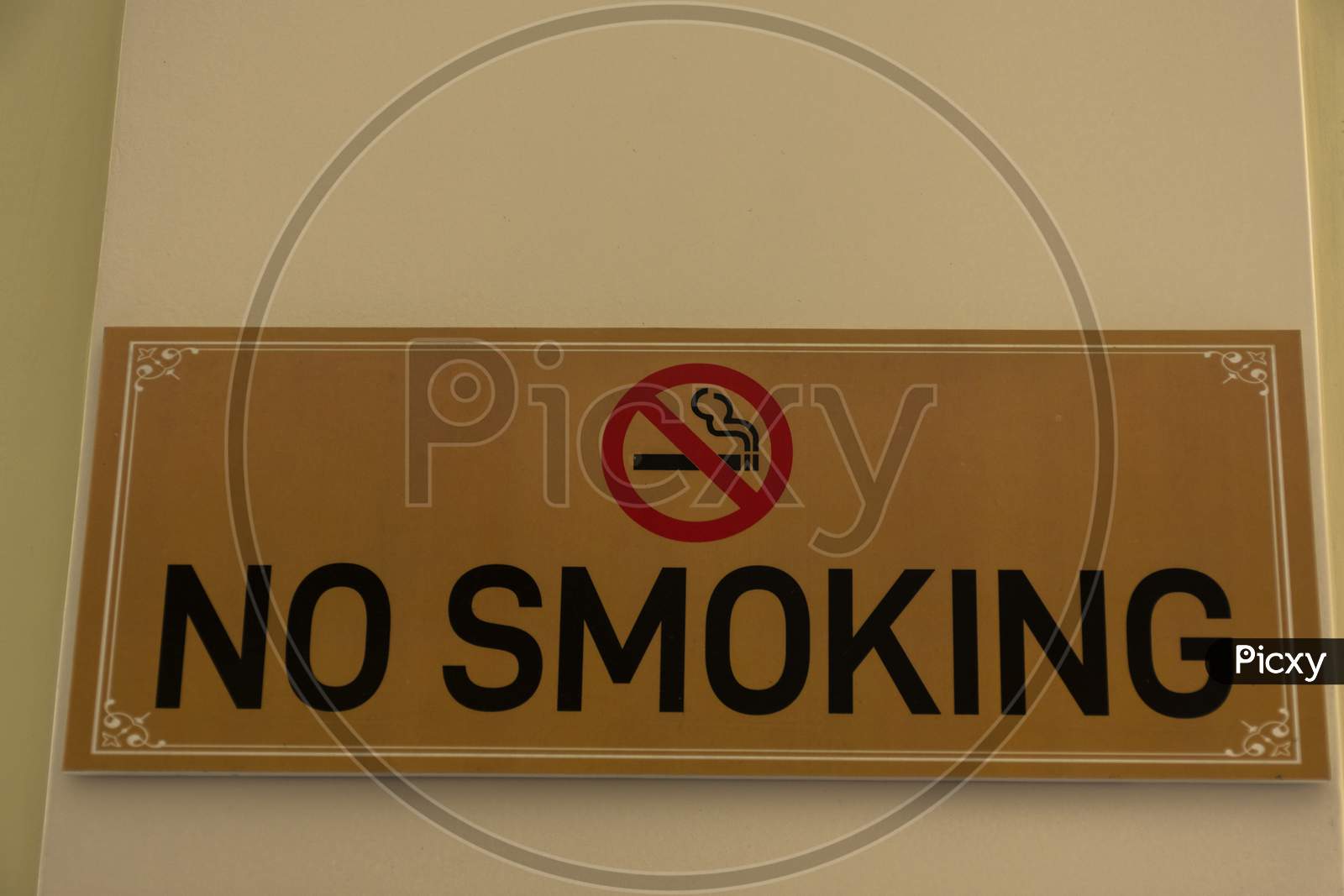 A No Smoking Sign Board On Wall