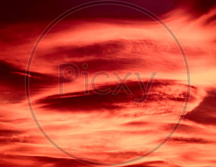 Red Sunset Sky With Clouds Background