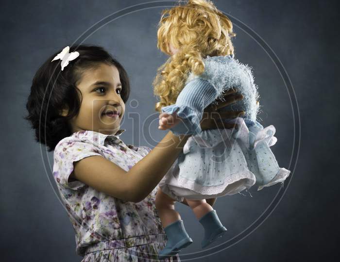 little girl with doll
