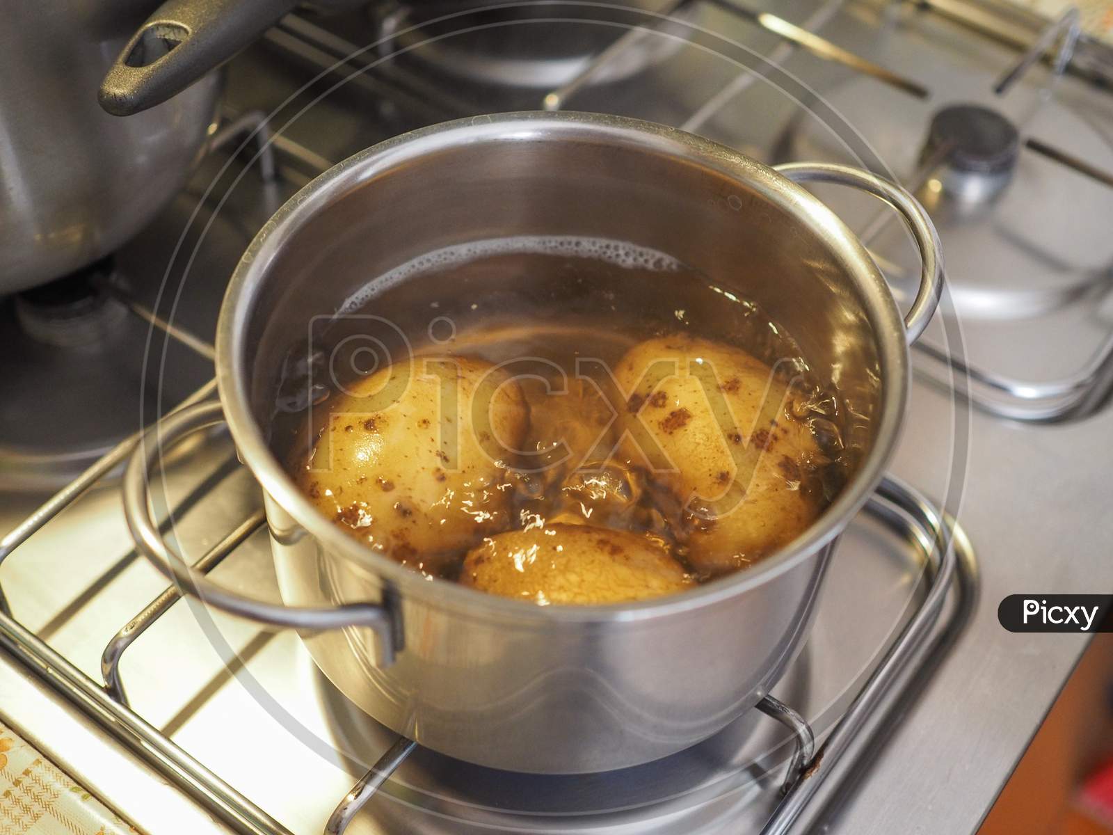 Boiling Potato In Saucepan
