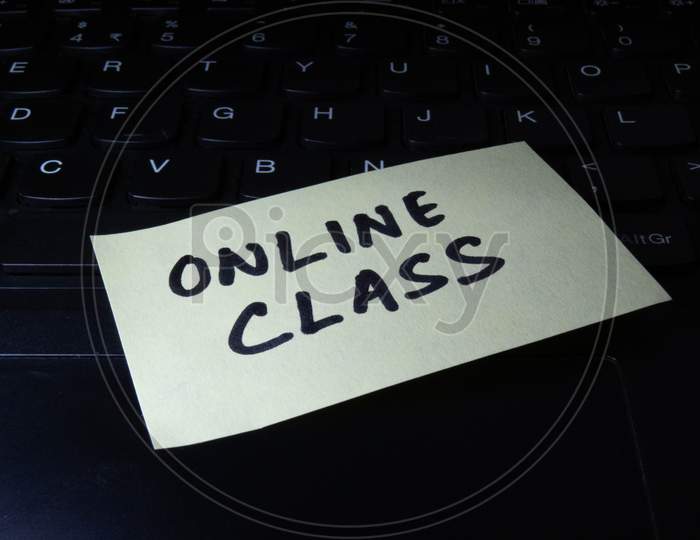 Concept Of Online Class Written On Sticky Notes Attached On Laptop.