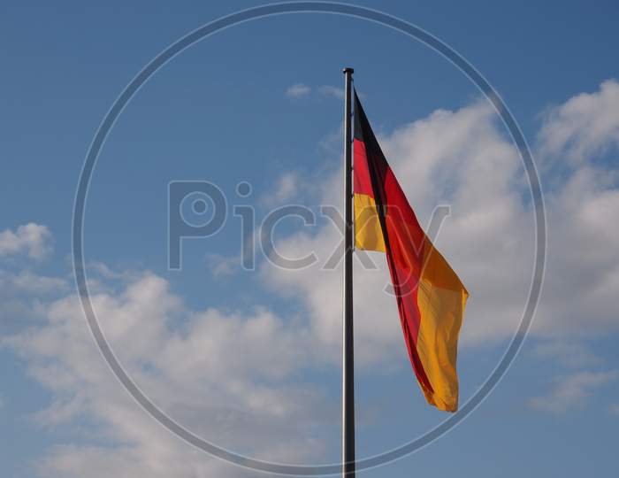 German Flag Over Blue Sky