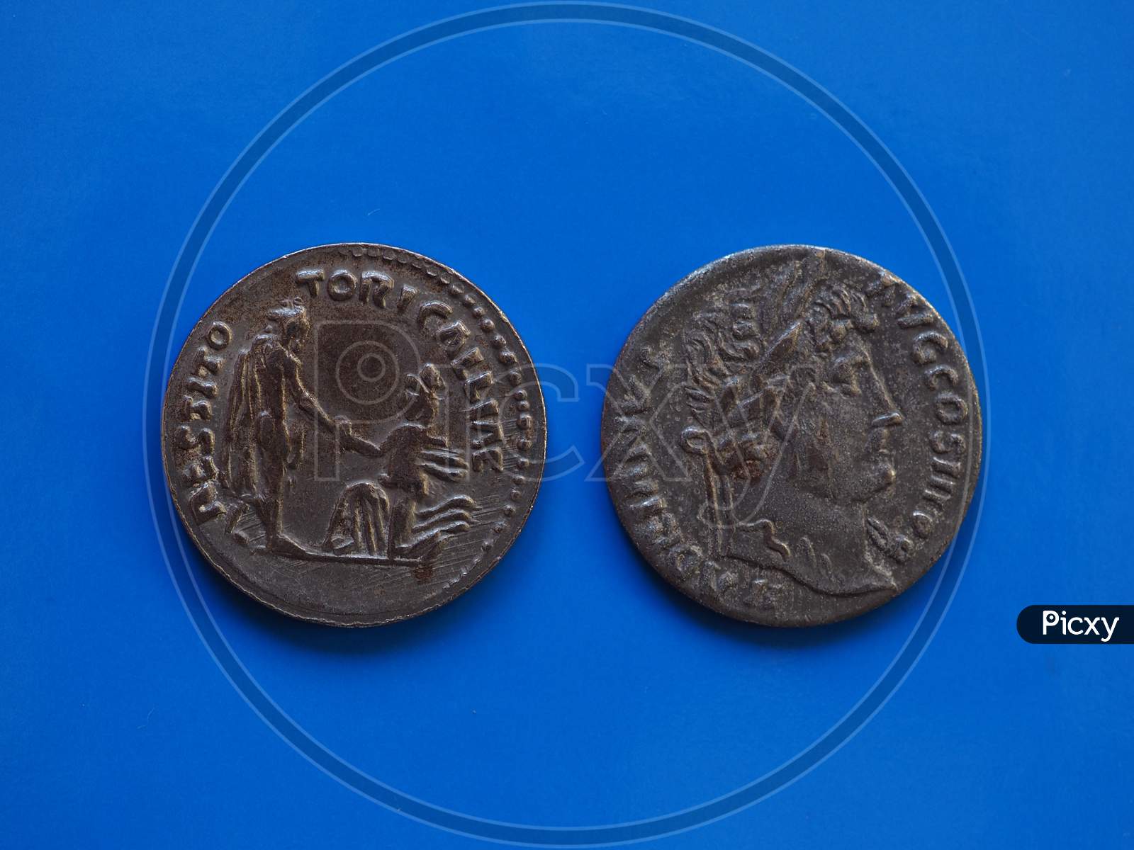 Vintage Roman Coin Over Blue
