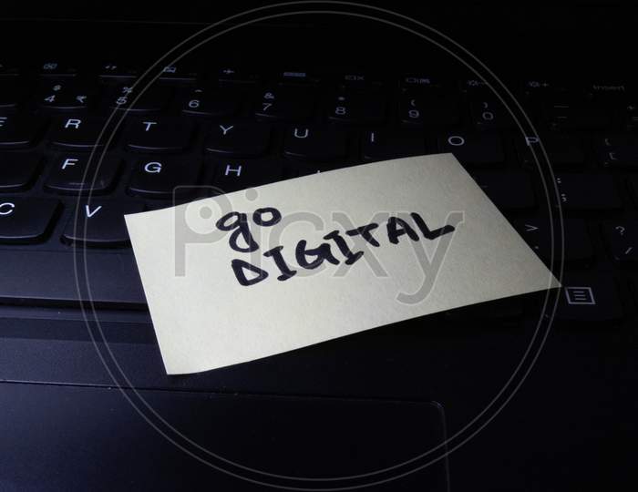 Concept Of Go Digital Written On Sticky Notes Attached On Laptop.