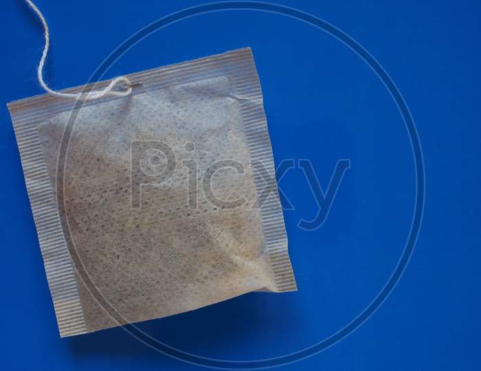 Tea Bag Over Blue With Copy Space