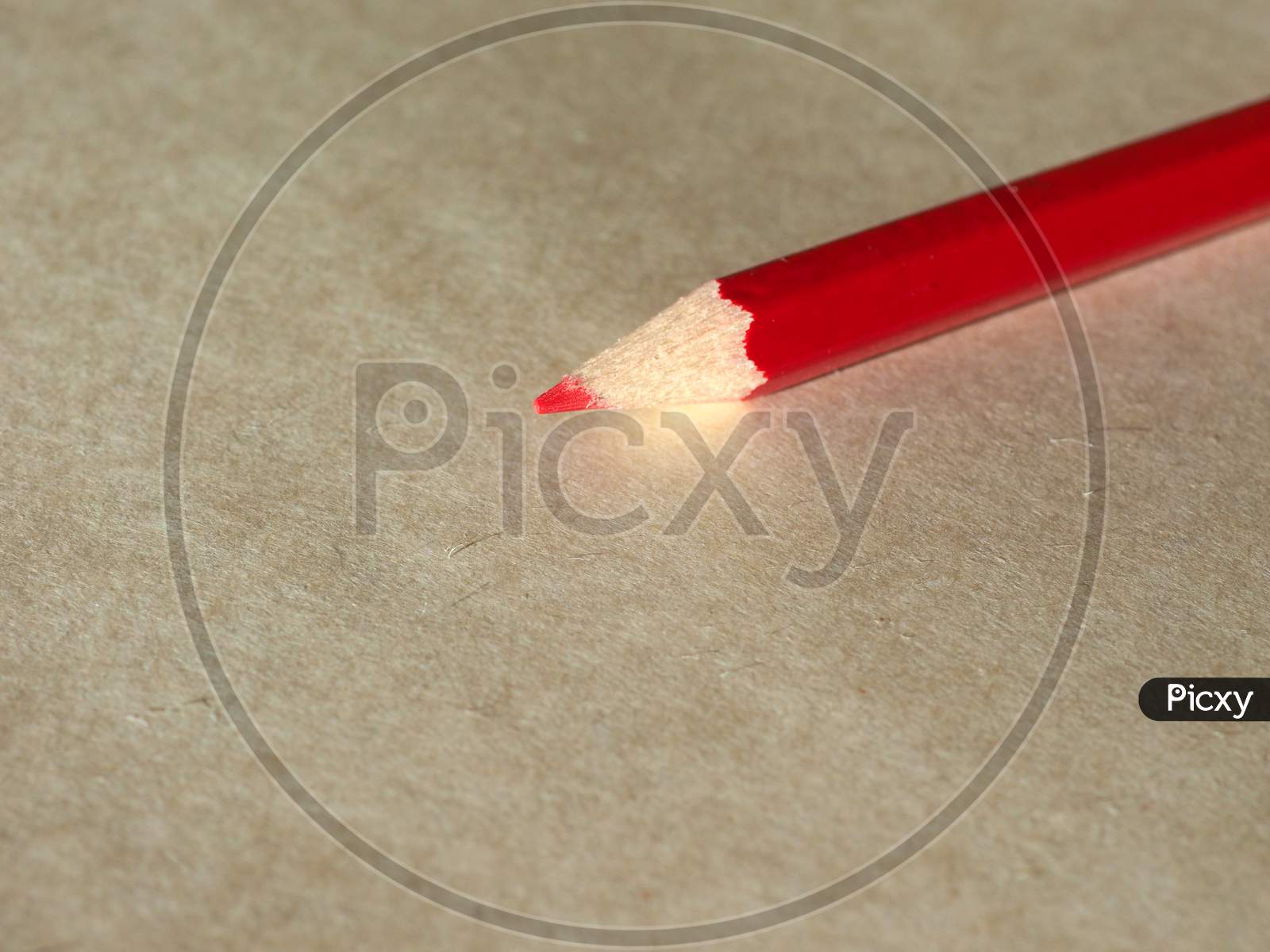 Red Pencil Over Paper