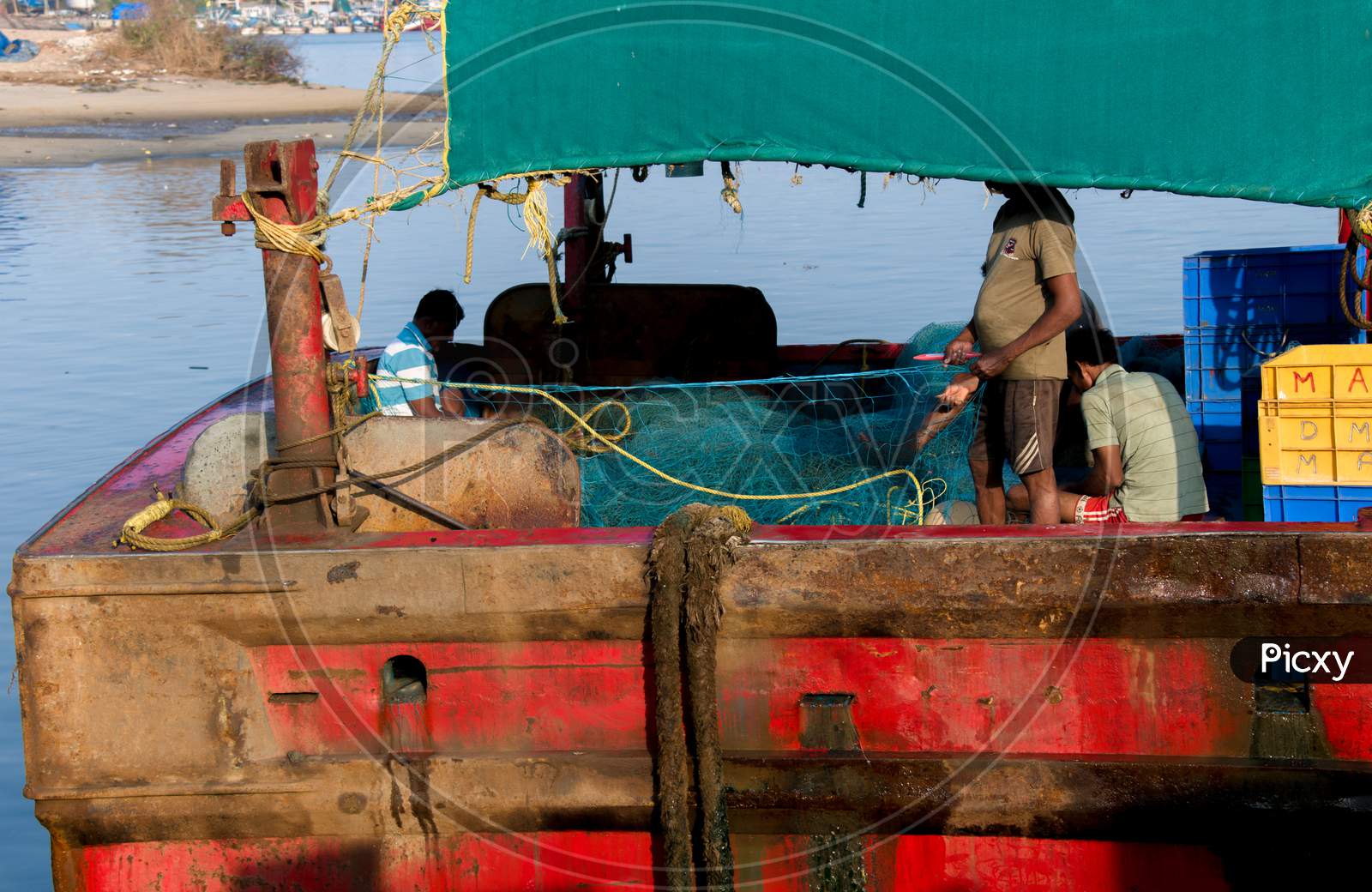 "Mangalore, Karnataka , India- 04-01-2021:Fishermen Preparing Nets For Fishing On The Ship.
