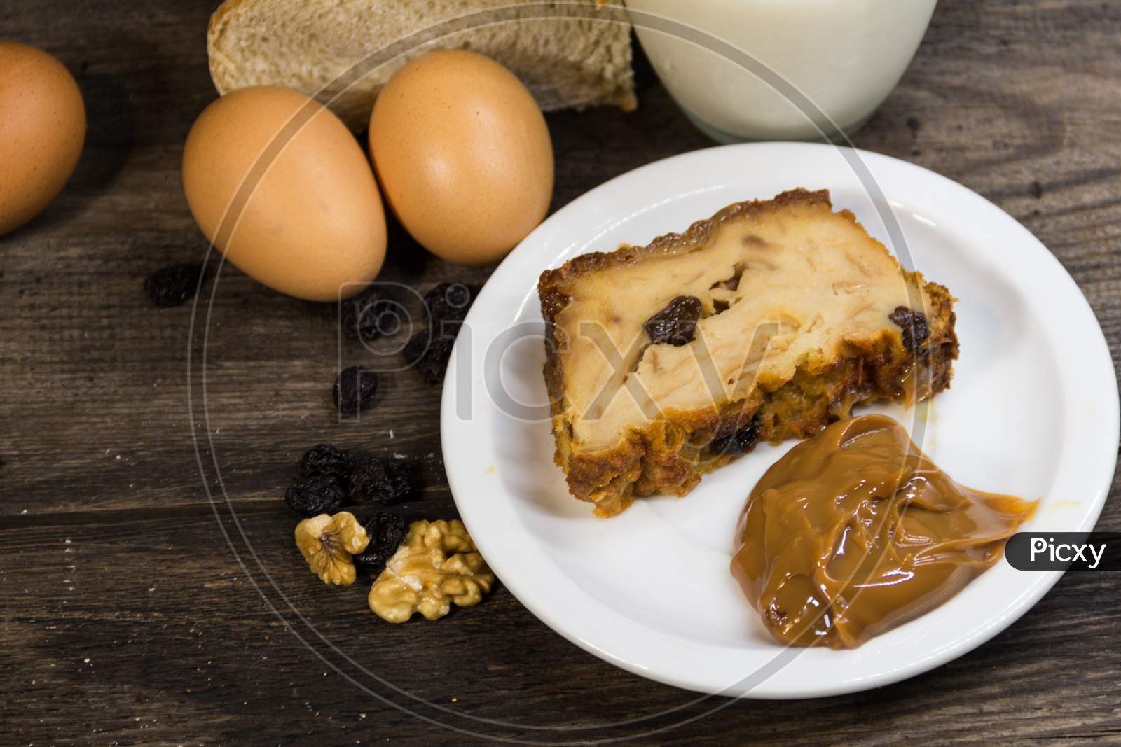 Portion Of Bread Pudding, Made With Milk, Eggs, Stale Bread And Fruits And Dulce De Leche
