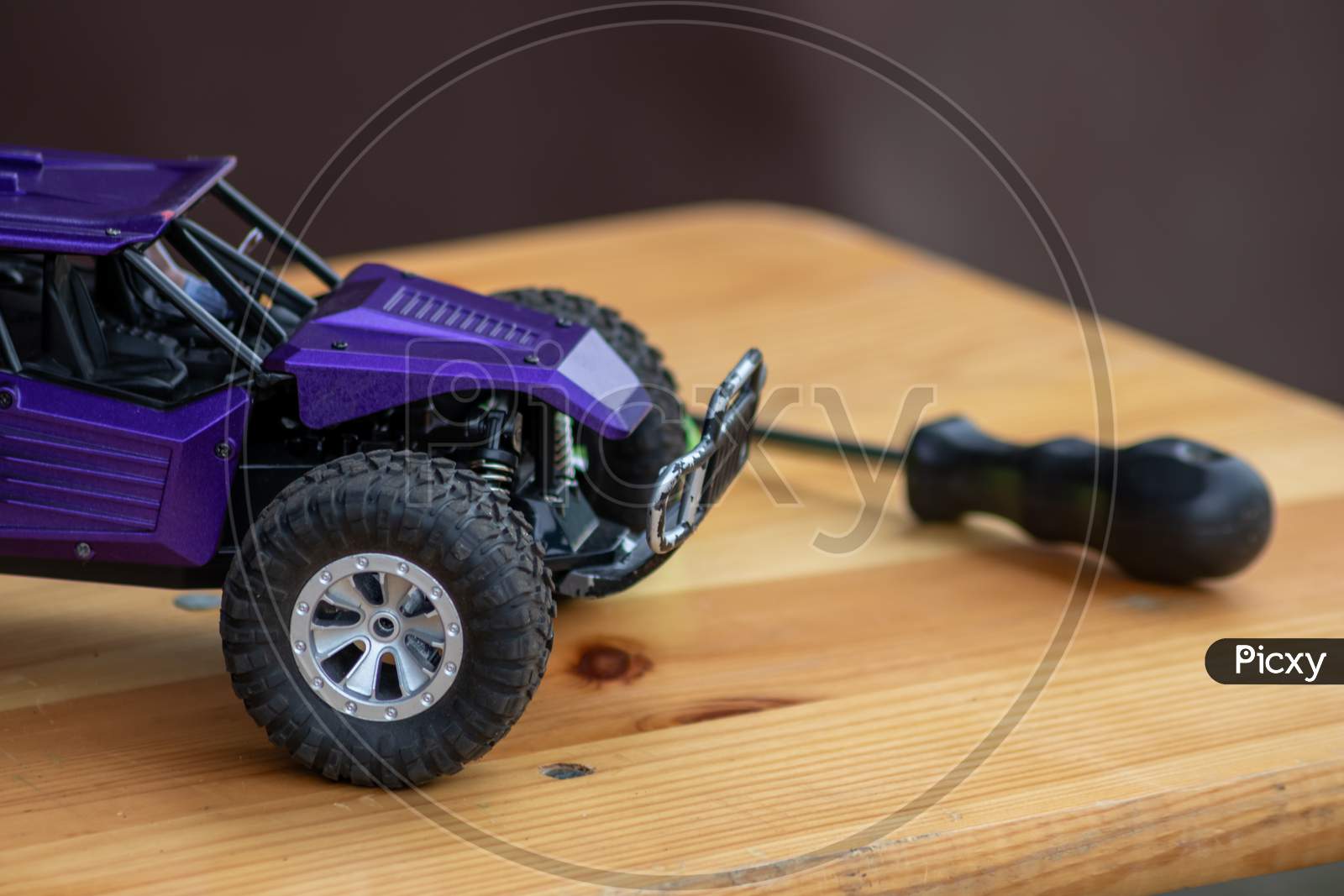 Image of Off road rc car with remote control and battery ready to race