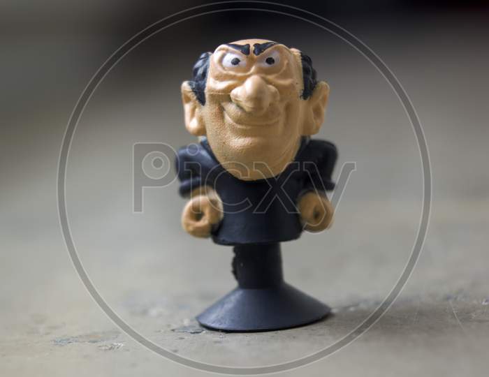Krakow, Poland - May 01, 2021: Extreme Close Up Macro Shot Of A Tiny Gargamel Rubber Toy Figure A Fictional Character From The Smurfs. He Is An Evil Wizard. Selective Focus. Shallow Depth Of Field