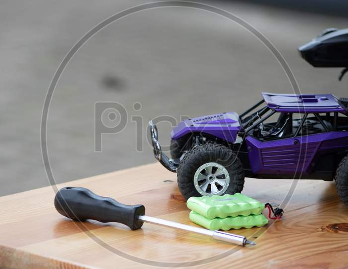 Image of Off road rc car with remote control and battery ready to race