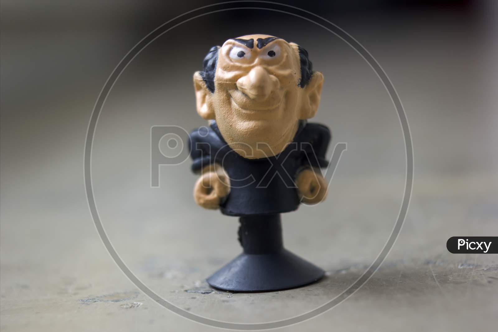 Krakow, Poland - May 01, 2021: Extreme Close Up Macro Shot Of A Tiny Gargamel Rubber Toy Figure A Fictional Character From The Smurfs. He Is An Evil Wizard. Selective Focus. Shallow Depth Of Field