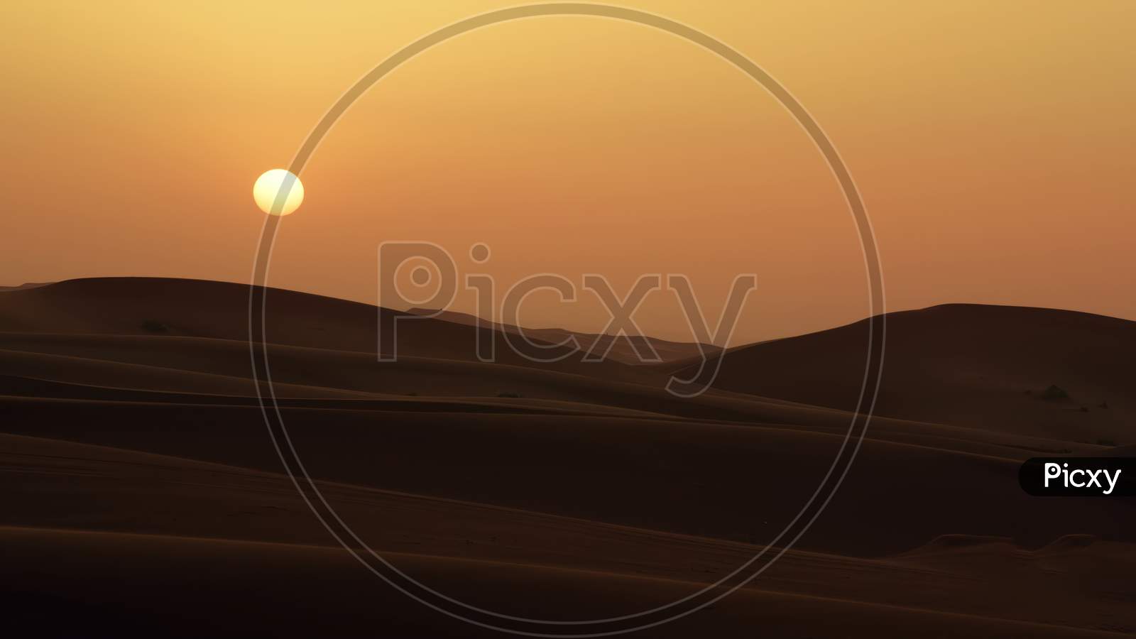 A beautiful  sun sets in the desert. Closeup image