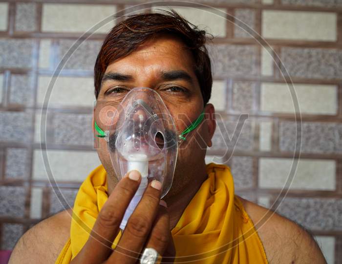Image of Indian Man Infected With Covid 19 Disease. Patient Inhaling