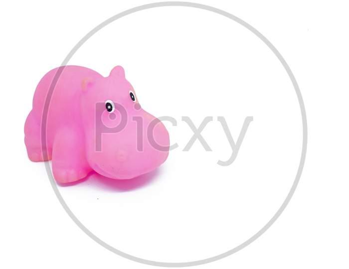 Pink Colored Plastic Hippopotamus Toy Isolated On White Background.