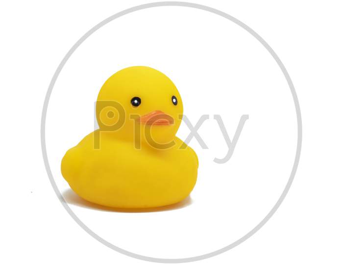 Cute Yellow Colored Plastic Duck Toy Isolated On White Background