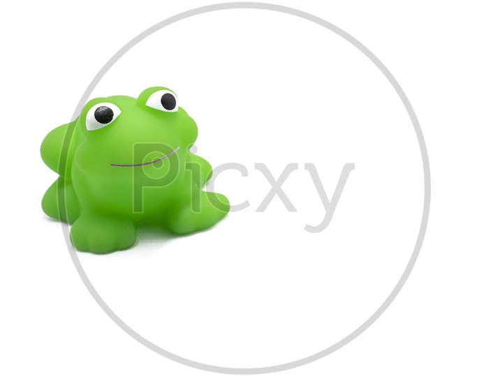 Smiling Green Plastic Toy Of Frog On White Background.