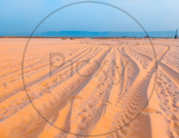 Tracks Wheels Marks In Sand Field