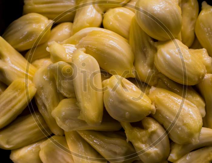 Closeup Photo Of Fresh Ripe Delicious South Indian Jackfruit Slices Placed In A Plate, Tropical Fruit. Peeled Fruit Soft Focus Selective Focus.