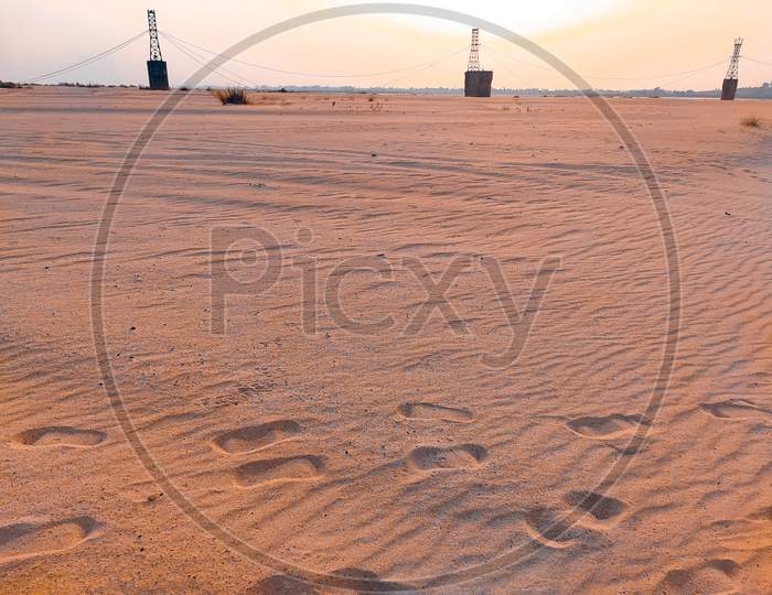 Foots Marks In Sand Desert Land