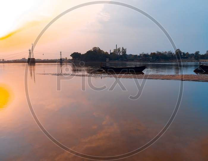 Boat On The River With Sky Background