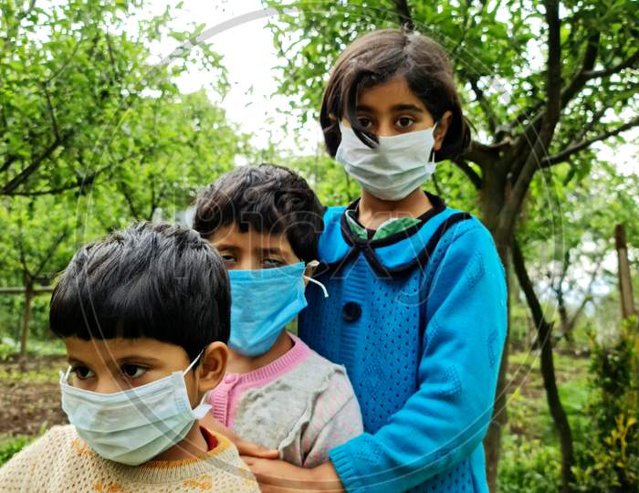 Image of Masked Children Looking Camera An Asian.-NL198314-Picxy