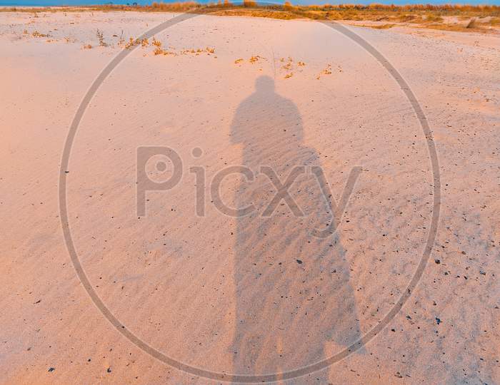 A Shadow In Sand Desert With Sky Background