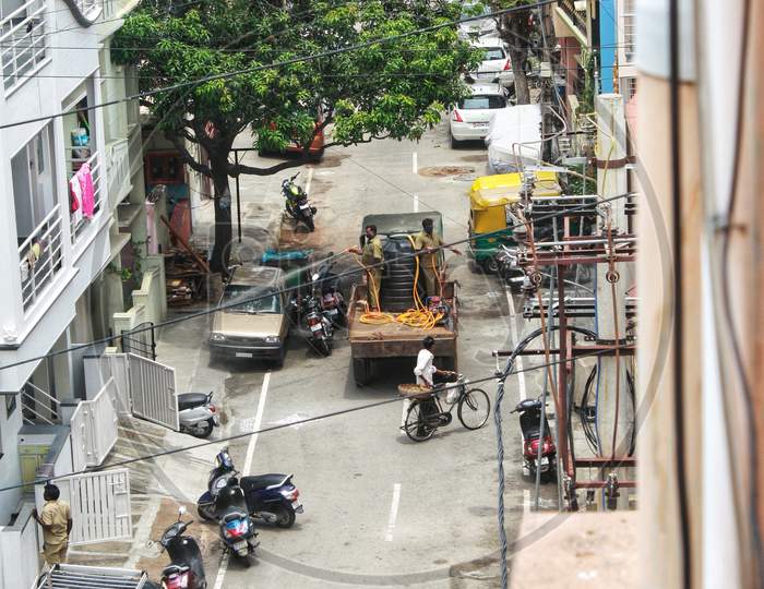 Personnel spray Disinfectants throughout the streets in Bangalore. Sanitizing residential areas to prevent the spread of Covid-19 during second wave lockdown