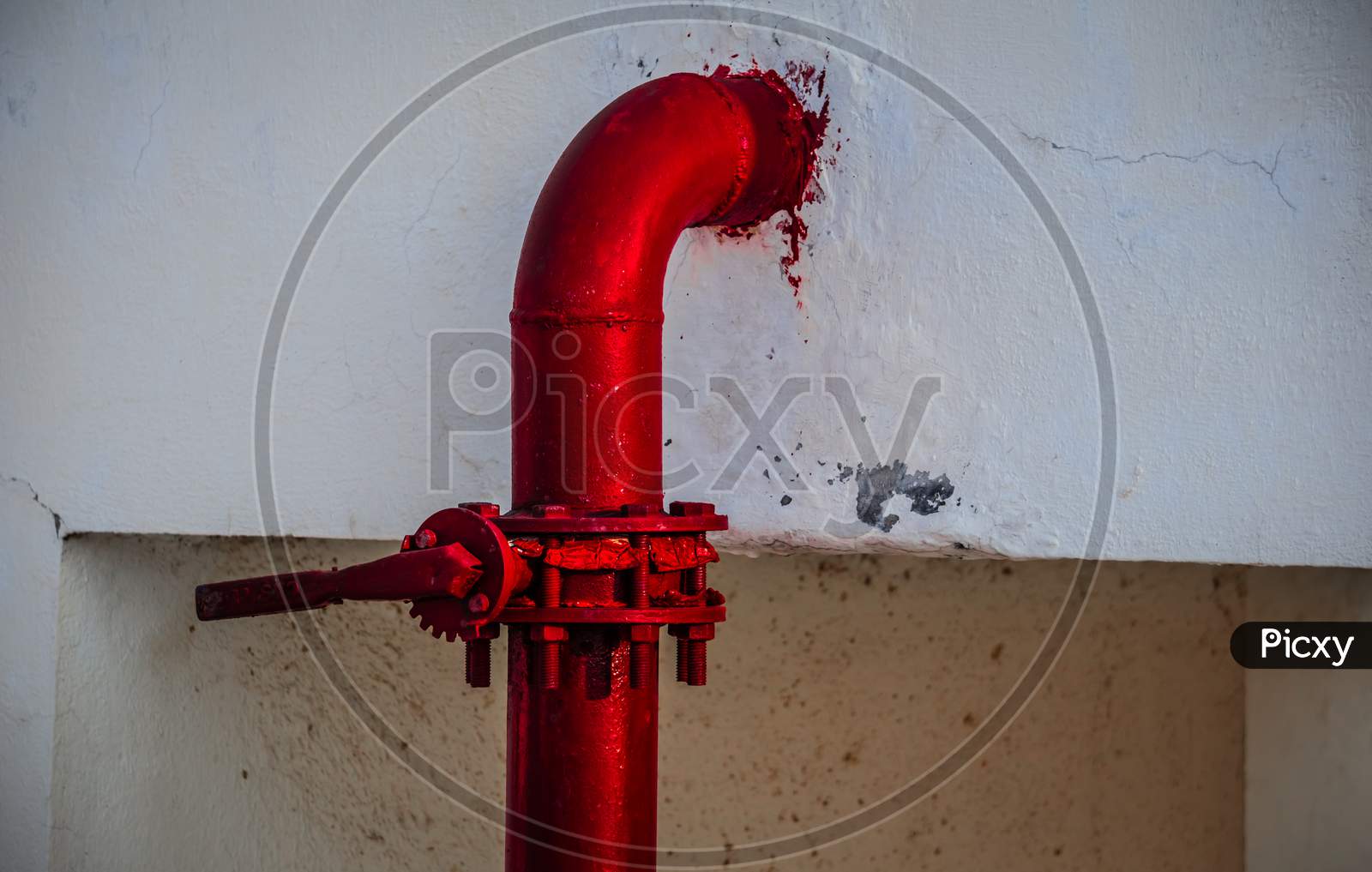 Red pipe of Fire Fighting systems is supplying water to the water sprinkler or private fire hydrants. Pipeline and valve arrangement connected from the water tank