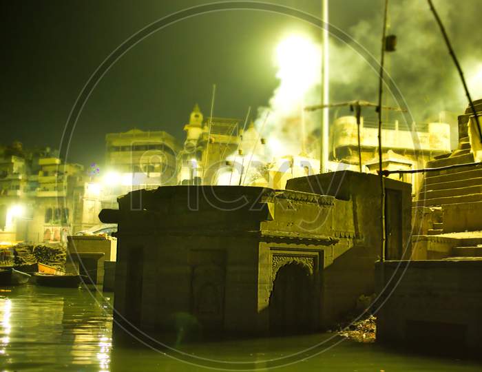Smokes Spreading From Fire Due To Cremation Next To Ganga River In Varanasi, Located In The State Of Uttar Pradesh, India
