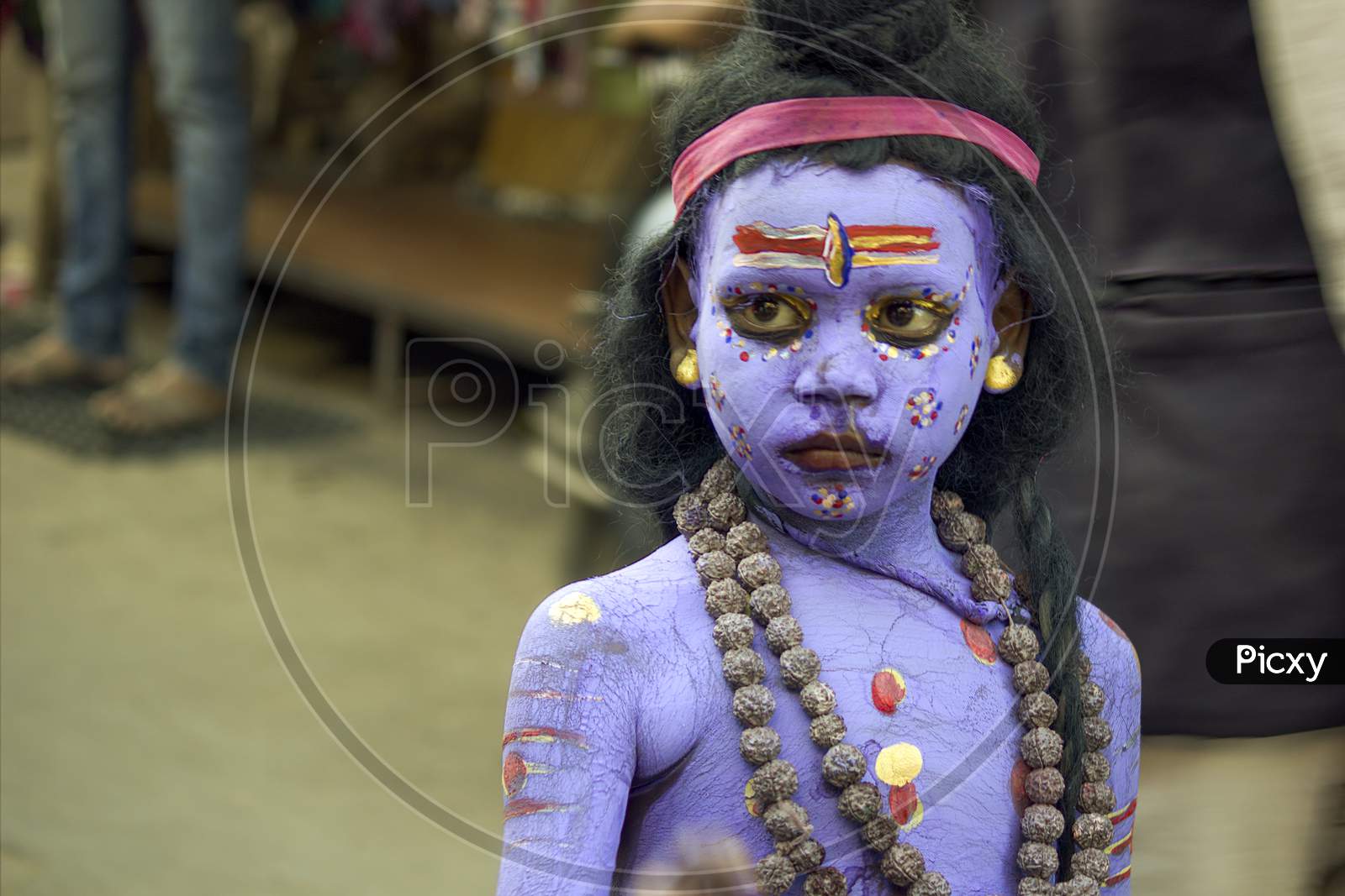 Pushkar, India - November 10, 2016: A Little Kid Boy Dressed Up Or Disguised As God Shiva With Blue Paint All Over In Order To Attract Tourists For A Living During Famous Camel Pushkar Mela Festival.
