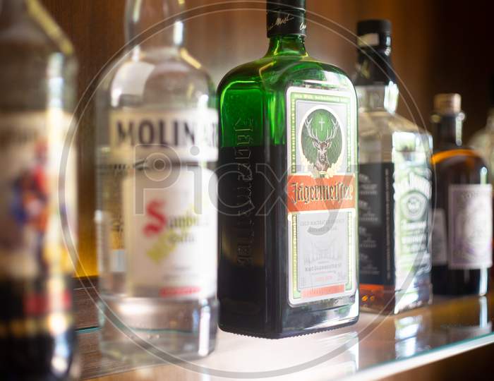 Bottles Of Liquor Alcohol Gin Rum Vodka On A Wooden Shelf In A Pub Bar Restaurant Hotel Or Home In India Showing The Growing Interest In International Liquor