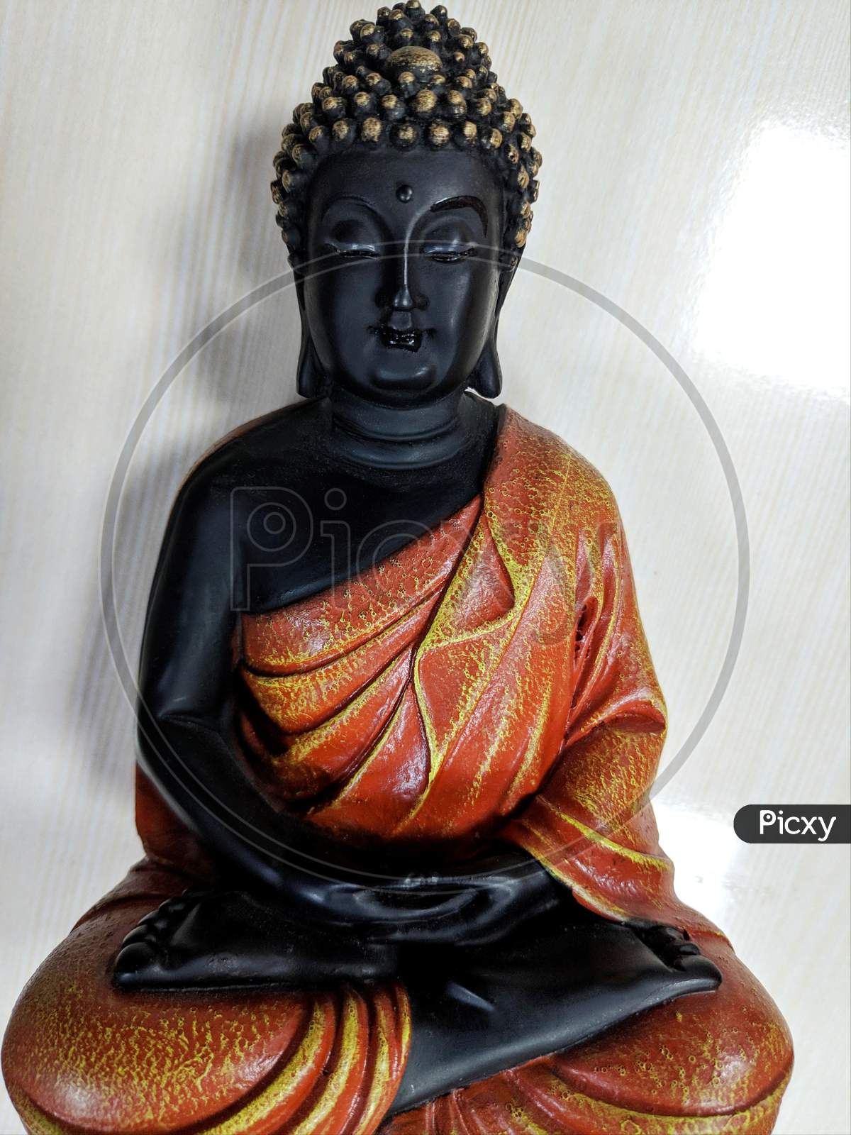 Buddha In A Meditation Pose, Under Protection Of The King Of Nag - Mukalinda. Figure Isolated On A Black Background.