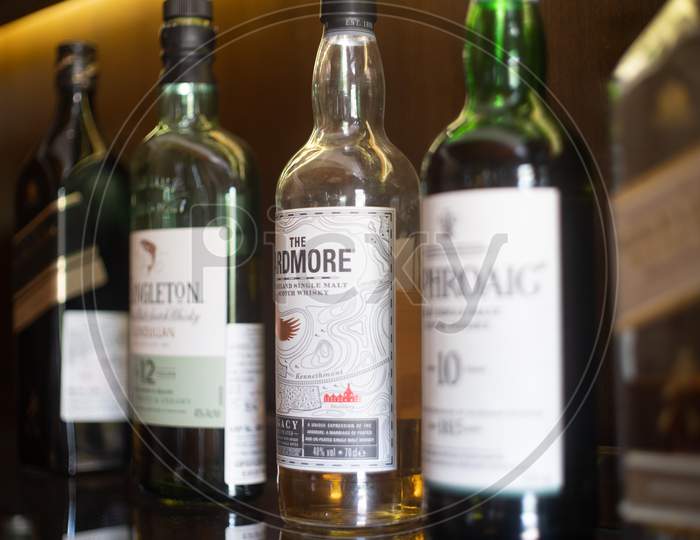 Bottles Of Liquor Alcohol Gin Rum Vodka On A Wooden Shelf In A Pub Bar Restaurant Hotel Or Home In India Showing The Growing Interest In International Liquor