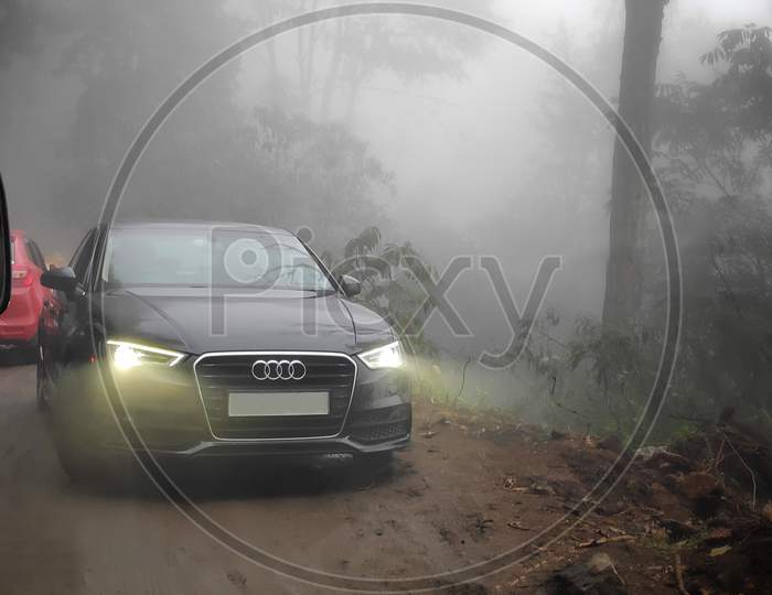 Winter Landscape View Of A Audi Company Cars On Road Surrounded By Trees Covered With Fresh Snow At Night, Kodaikanal.India.