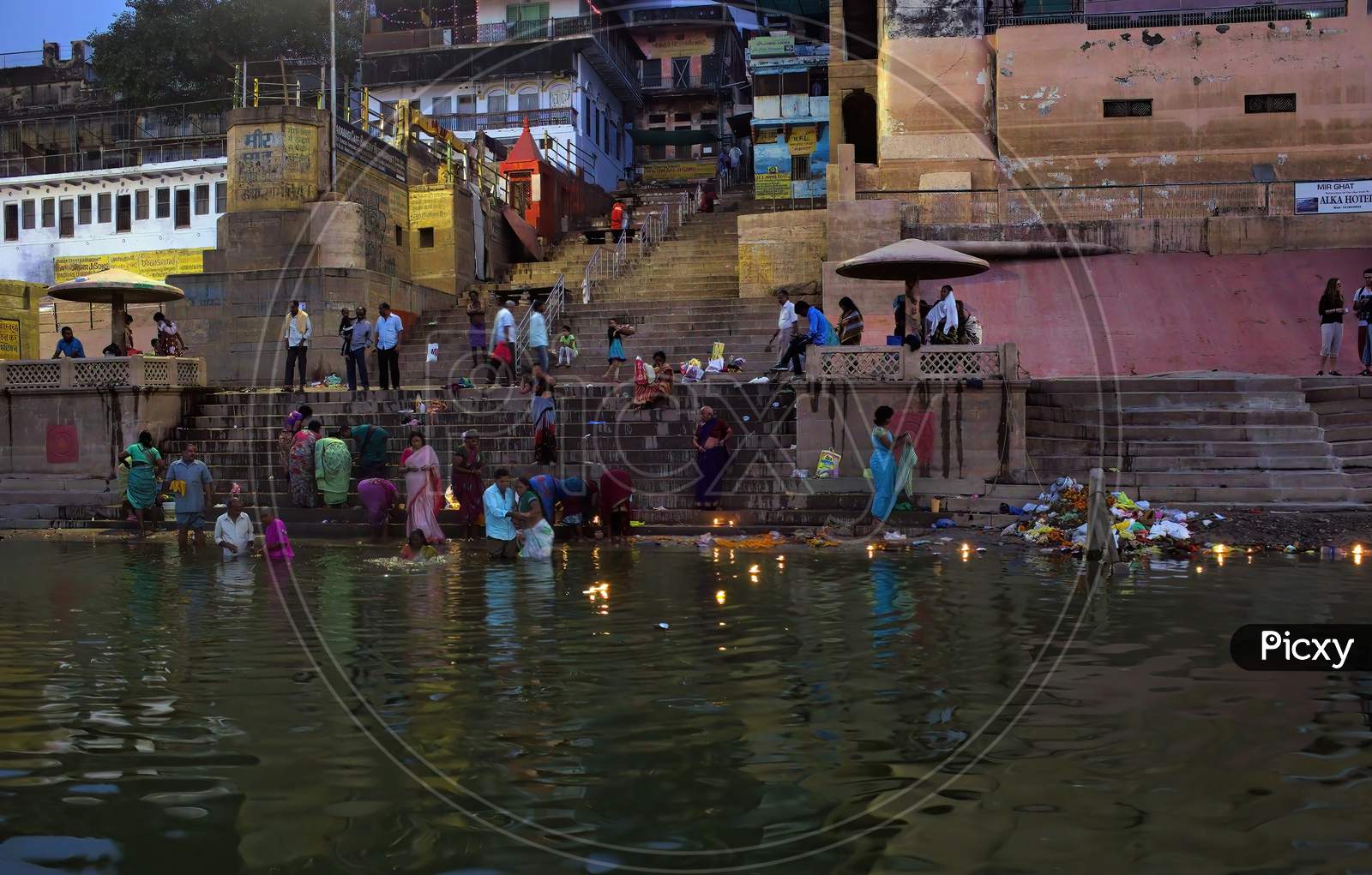 Varanasi, India - November 01, 2016: Hindu Family And Friends Take An Early Morning Dip In The Ganges At Varanasi To Pray And Wash Away Their Sins In A State Of Uttar Pradesh