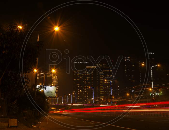Motion Speed Light Of Kolkata City. Light Trails Of City Traffic At Night On Famous Hotel Buildings Of Kolkata, India.
