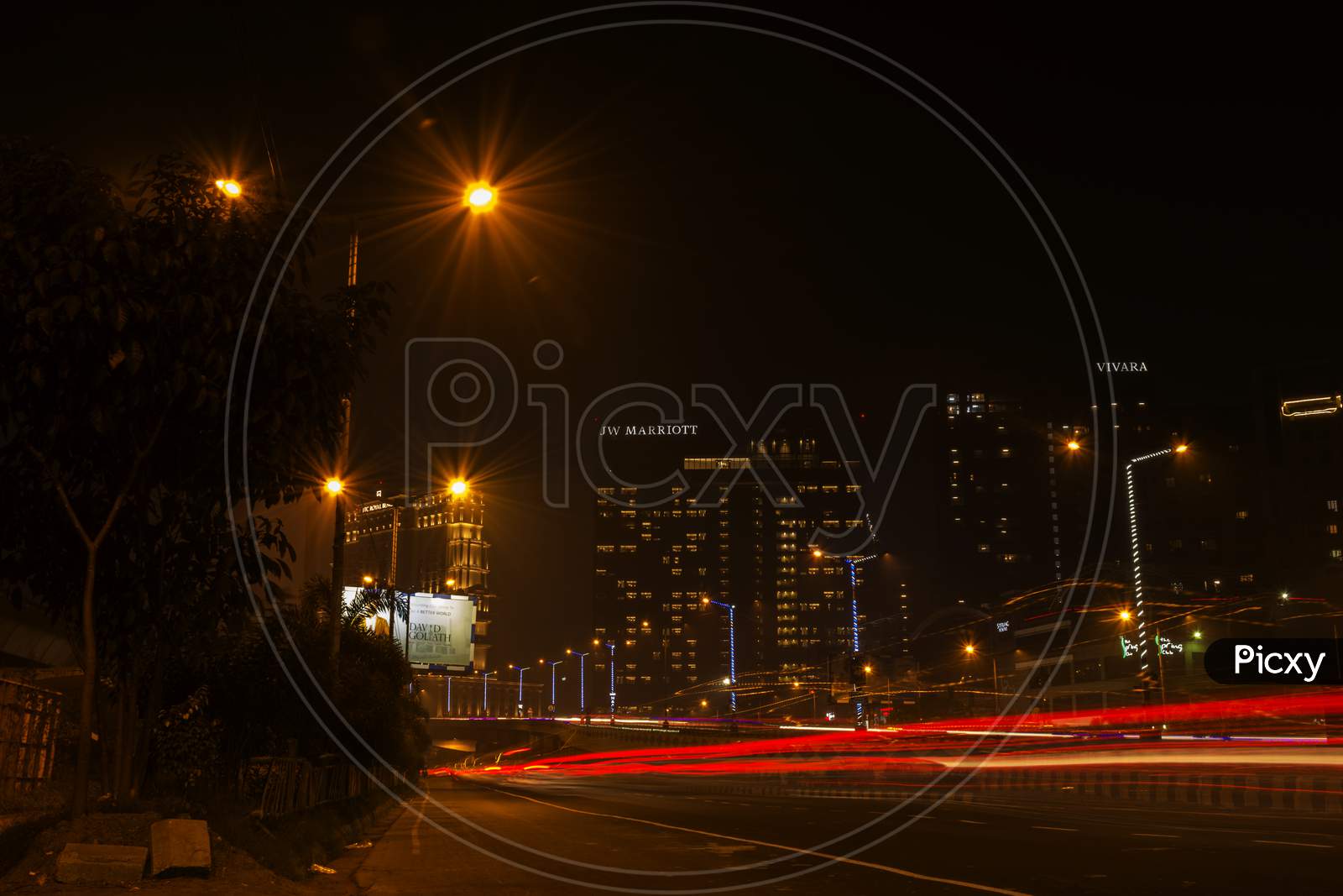 Motion Speed Light Of Kolkata City. Light Trails Of City Traffic At Night On Famous Hotel Buildings Of Kolkata, India.