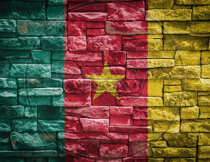 National Flag Of Cameroon On Stone  Wall Background.The Concept Of National Pride And Symbol Of The Country. Flag  Banner On  Stone Texture Background.